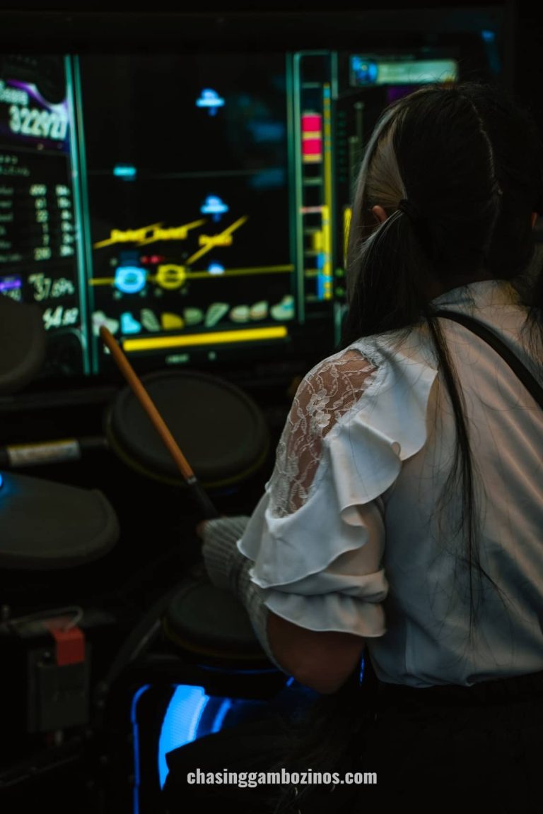 Japanese woman playing arcade game in Akihabara.