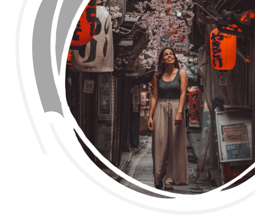 Cover of travel blog on best things to do in Tokyo, featuring a woman walking in Omoide Yokocho, one of the best things to do in Tokyo, Japan.