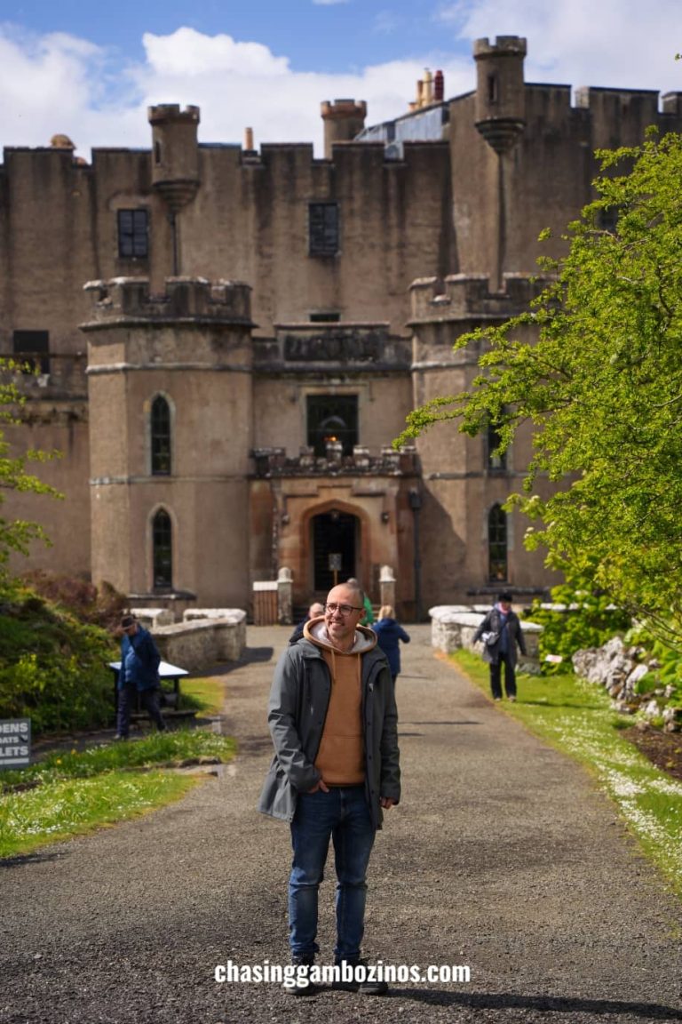 Man in front of the Dunvegan Castle, visited during the 5 day Scotland tour.