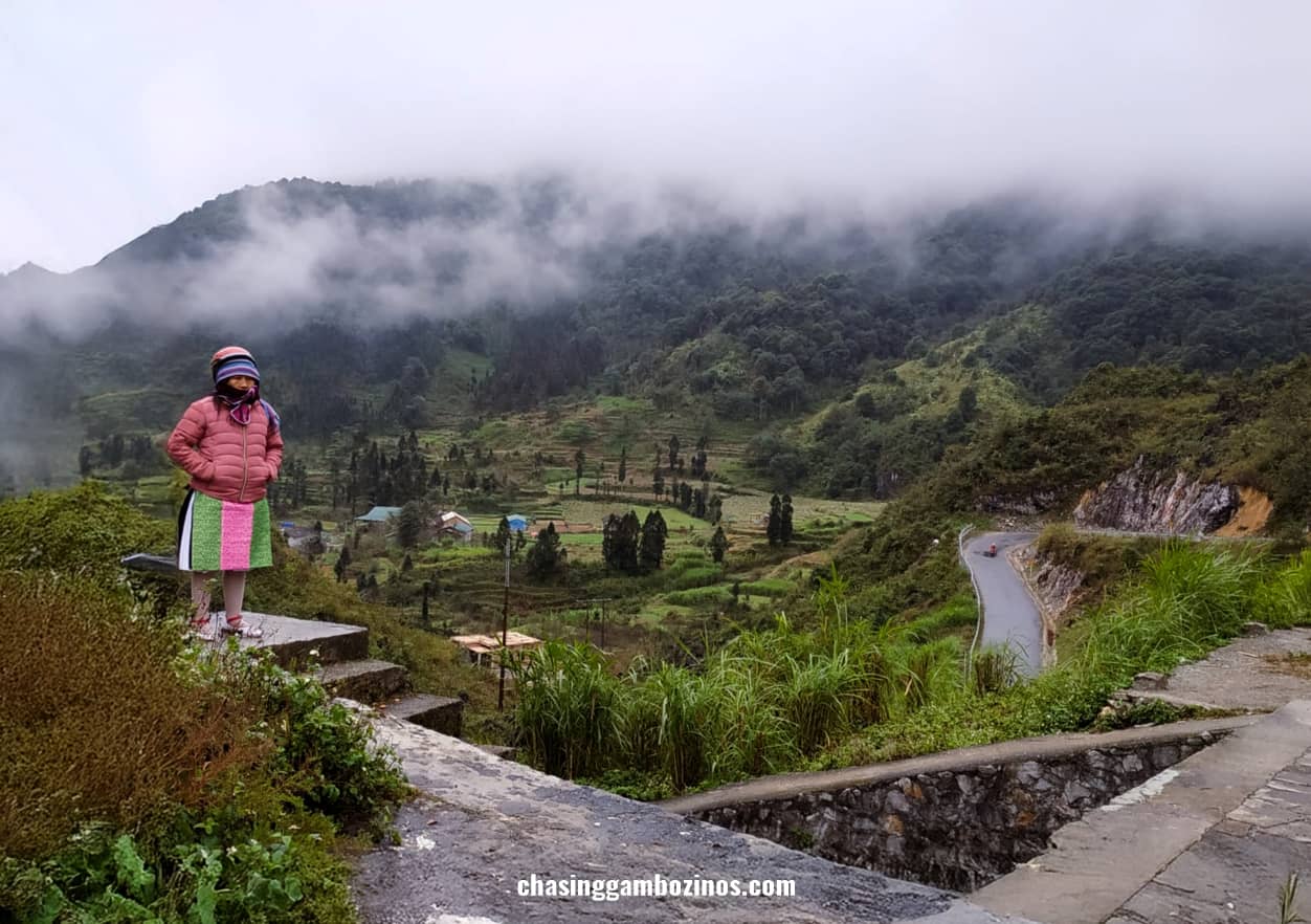 Lady dressed in local attire near one of the ethnical villages visited during Ha Giang loop tours.