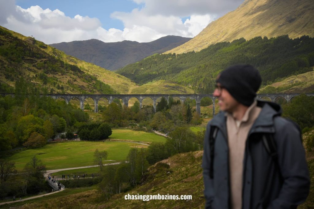 Man visiting the Glenfinnan Viaduct, famous as the Hogwarts Express in Harry Potter.