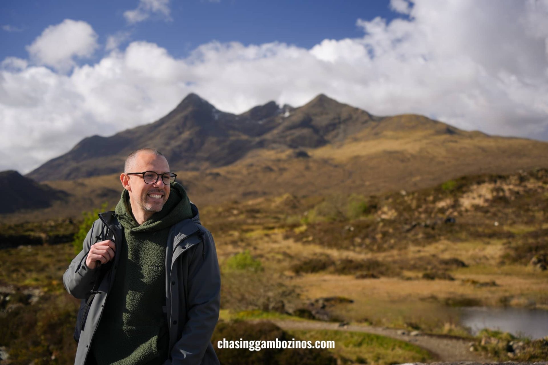 Man admiring the mountains during the Isle of Skye tour from Edinburgh.