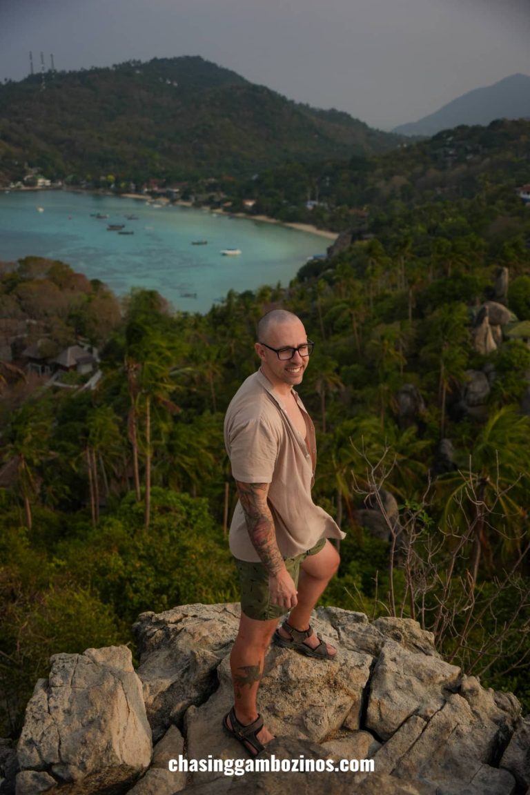Man on top of the best viewpoint in Koh Tao, John Suwan Viewpoint.