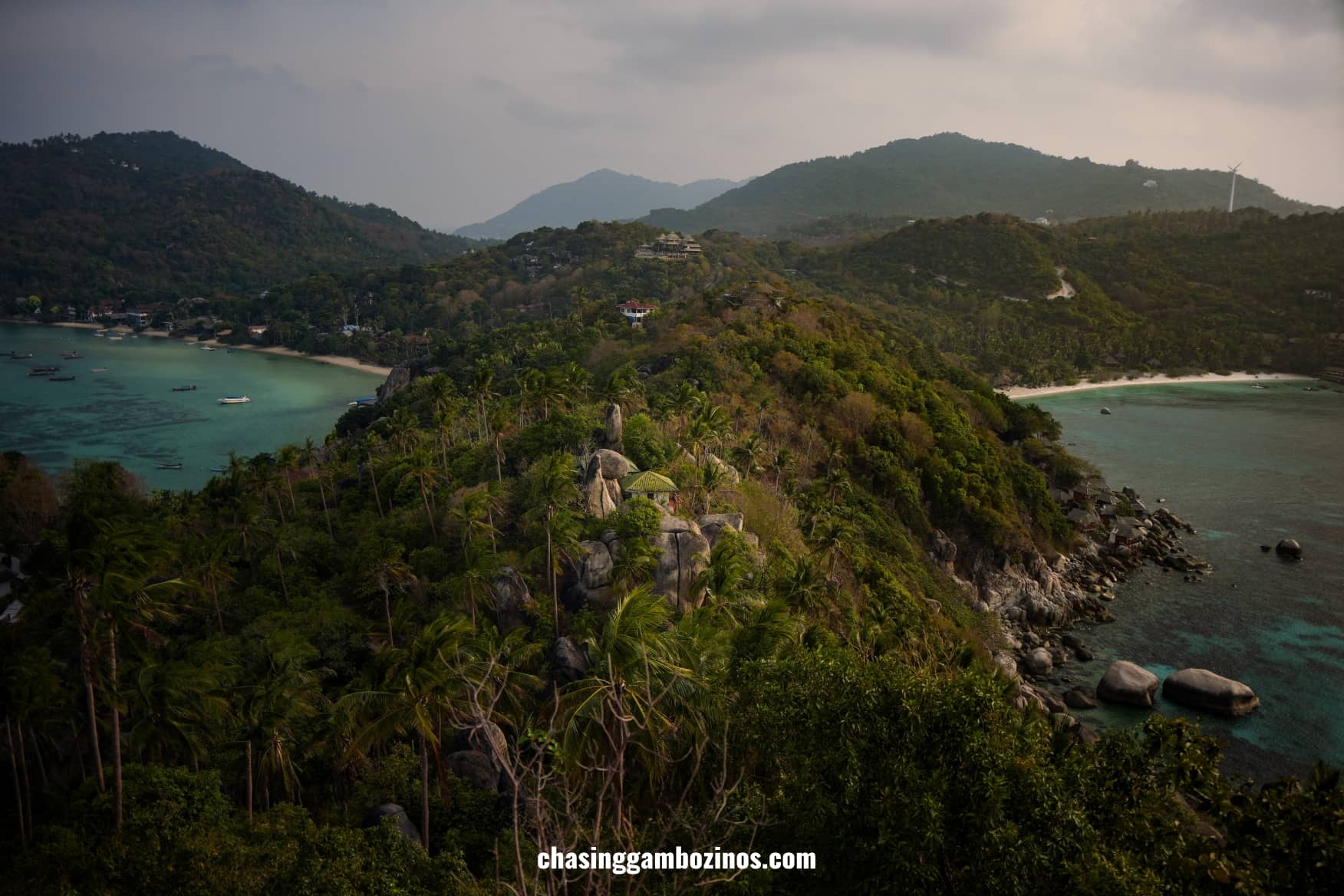 View from John Suwan Viewpoint, with a ridge covered in palm trees in between two amazing bays.