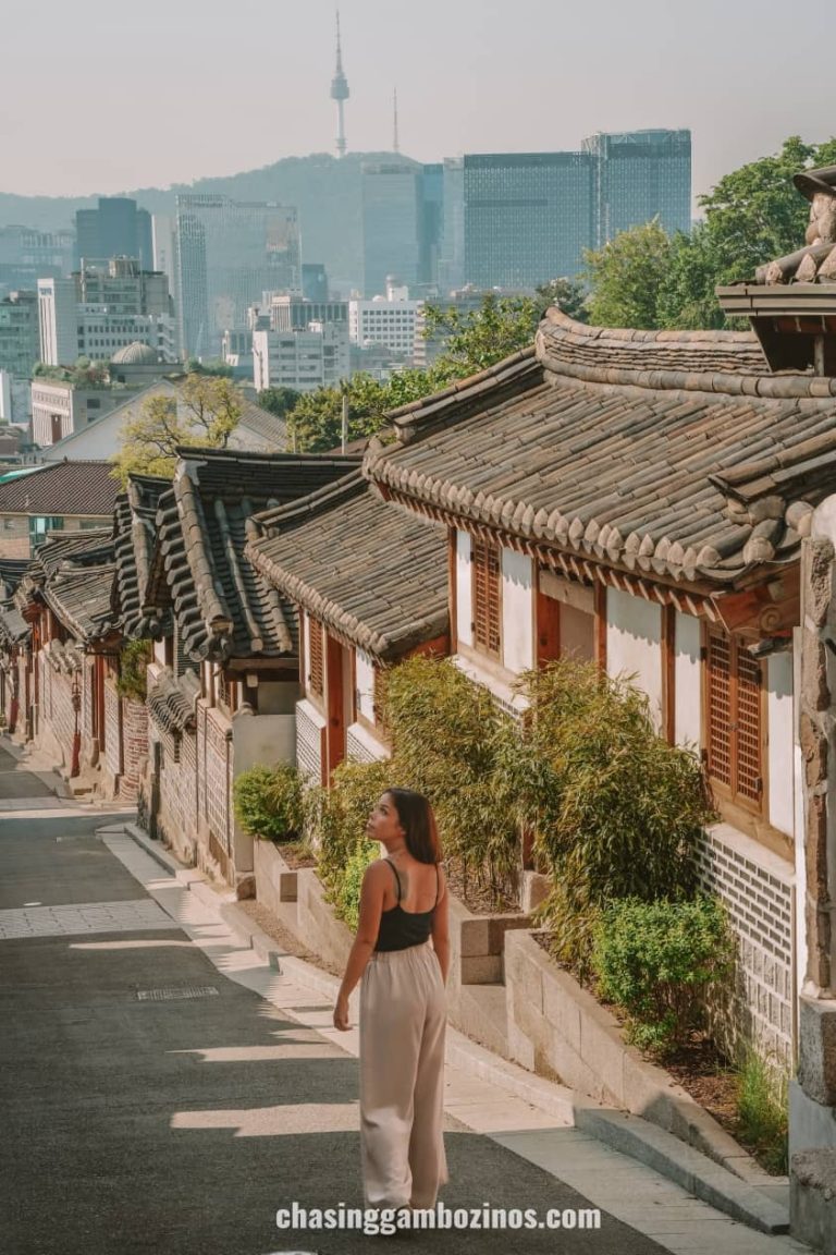 woman walking at opening hour of bukchon hanok village.